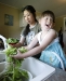 Clarkson Elementary School kindergarten student Michell Lynch washes fresh-picked lettuce with her mother Tomoko Lynch during the Get Going Gardening program at Lincoln Trail Elementary School (Hardin County) June 15, 2010. Photo by Amy Wallot