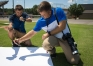 Jeremy Byrn, right, an environmental science teacher at Allen County-Scottsville High School, and his son Austin observe crescent shadows during the solar eclipse. Byrn and other science teachers in the district participated in a series of departmental meetings to prepare for the day of the eclipse. Photo by Bobby Elllis, Aug. 21, 2017