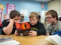 Tyler Lilly, from left, Corbin Watters and Teagan Ives read in their 5th-grade class. Photo by Bobby Ellis, Dec. 8, 2016