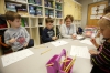 Teaching assistant Rhonda Hester leads a dice game 1st-grade students were playing to work on their sight words. Photo by Amy Wallot, Jan. 28, 2015