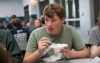 Hunter Price, an 8th-grade student, eats a bowl of white chicken chili prepared from Katie McClain's recipe during lunch. Photo by Bobby Ellis, Nov. 28, 2017