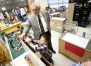 Preschool student Bowen Carmen clips a piece of paper to an art easel with help from Commissioner Terry Holliday at Green County Primary School. Photo by Amy Wallot, Jan. 15, 2013