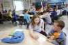 Heather Allen helps her classmate Kyle Norris with multiplication problems during Cecilea Stephens' 3rd-grade class. Photo by Amy Wallot, April 20, 2015