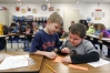 Third-grade students James Taulbee and Dillon Berryman use manipulatives to find the area of a shape during Stephanie Rice’s class at Trapp Elementary School (Clark County). Photo by Amy Wallot, Feb. 21, 2013