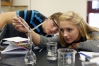 Seniors Carly Dothsuk and Dalton Barnes prepare a solution during Simone Parker\'s AP Chemistry class at Trigg County High School. Photo by Amy Wallot, Oct. 15, 2013