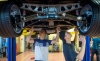Warren County Area Technology Center students Doc McClendon, left, and Alex Robertson check the suspension of a 1980 Corvette being rebuilt for competition in the On Track motorsports education initiative. Students are judged on everything from the car's performance to their own business and marketing plans in their competition with students from South Central Community and Technical College. Photo by Bobby Ellis, May 11, 2017