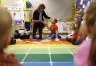 Preschool teacher Donna Howard asks Dakota Postlewaite to chose a math tool that will help him measure shoe size if he were an employee at a local shoe store during class at Whitesville Elementary School (Daviess County). Photo by Amy Wallot, Feb. 5, 2015