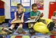 Aaron Childress and Clinton Davis read together during Cathy Chaffman\'s preschool class at Whitley County Central Primary School Sept. 21, 2010. Photo by Amy Wallot
