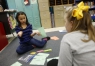 Omi Bass explains her mathematics answer to her partner Brinley Samons. Photo by Amy Wallot, Dec. 2, 2014