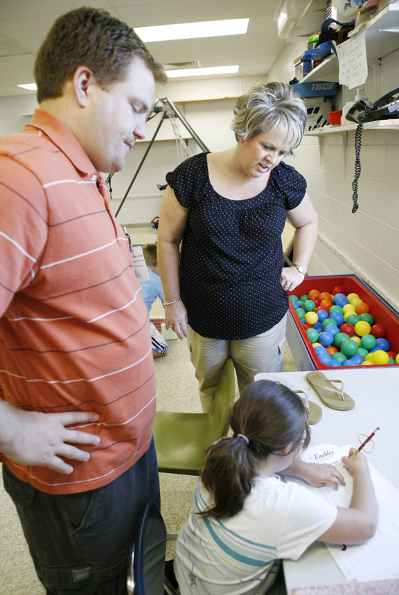 Teachers Daniel Pagan and Stephanie Arnold work with a student in the sensory room at Dry Ridge Elementary School (Grant County) May 4, 2010. Pagan is one of the five teachers Arnold has mentored in the Kentucky Teacher Internship Program, which is designed to provide assistance to new teachers. Photo by Amy Wallot