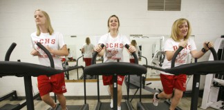 Freshman Jenny McIntosh, left, Jerrika Combs, center, and Emily Wink use treadmills that were donated to Daviess County High School by a local hospital as part of the district’s Graduation 2010 program. The program, which was originally designed to expose students to the arts, has grown to include components such as music, foreign language, literacy, critical thinking, physical and emotional health, and family and community involvement. Photo by Amy Wallot