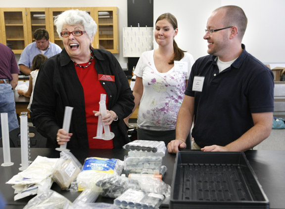 Biology consultant Ann Griffin, left, works with Holmes High School (Covington Independent) teacher Elaine Eifert and Warren Central High School (Warren County) teacher Joey Norman on an experiment during the 2010 Advanced Placement (AP) Summer Institute at Western Kentucky University June 28, 2010. The institute provides AP teachers the opportunity to share experiences and brainstorm ways to improve teaching strategies and methods. Photo by Amy Wallot