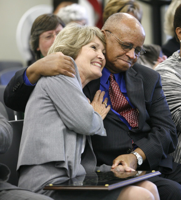 Helen Mountjoy hugs Samuel Robinson after being named the recipient of the Dr. Samuel Robinson Award during the Kentucky Board of Education meeting Oct. 6, 2010. Photo by Amy Wallot