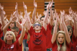 Eighth-grade student Clayton Meade, center in glasses, leads the student body in a choreographed dance to the Black Eyed Peas "I Gotta Feeling" during the Boyd County Middle School Schools to Watch ceremony March 30, 2010. Photo by Amy Wallot