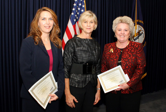 Kentucky Jump$tart Coalition Financial Literacy Teacher of the Year Jennifer Allen, left, and runner-up Sandy Maxted were presented with their awards by Kentucky first lady Jane Beshear Nov. 9, 2010. Photo by Brian C. Moore