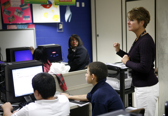 Julie Cheuvront gives her 8th-grade practical living/vocational studies class directions for the Missing game as part of the Web Wise Kids internet safety program at Lexington Traditional Magnet Middle School (Fayette County) Nov. 17, 2010. Photo by Amy Wallot