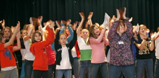 Connie Baynum, right, leads a practice for middle school students from Kenton County before a performance at Dixie Heights High School as part of the ASCENT Arts program Jan. 18, 2011. Photo by Amy Wallot