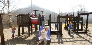 Children enjoy an unusually warm day during recess at Carr Creek Elementary School (Knott County) Feb. 17, 2011. The school's FRYSC raised money for the new playground. Photo by Amy Wallot