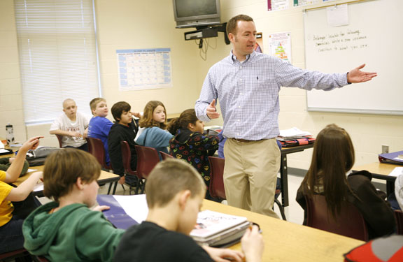 Rick Carr discusses misleading information in advertising during his 6th-grade health class at Woodford County Middle School March 9, 2011. The class was beginning a lesson on tobacco, alcohol and other drugs. Photo by Amy Wallot