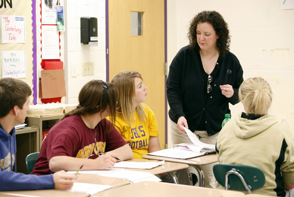 Jana Odom helps students with an assignment about origin stories during her English 4 transitional class at Somerset High School (Somerset Independent) March 10, 2011. Photo by Amy Wallot