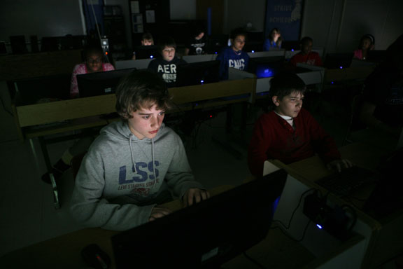 Sixth-grade student Brady Crowe uses Moodle to work on an assignment during Mike Hamilton’s class at Clark Middle School (Clark County). Students were learning to create Excel spreadsheets, and Hamilton was incorporating other class material by using planets and presidents as topics. Photo by Amy Wallot; March 2011