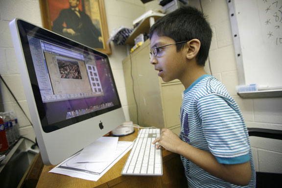 Second-grade student Ishaan Choch writes a blog post about his recent trip to India during Cheri Arrowood's class at Jackson City School (Jackson Ind.). The writing Program Review includes communications for the 21st century. Photo by Amy Wallot, April 2011