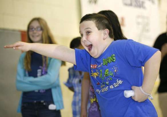 Fifth-grade student Chase Robinson plays Just Dance 2 as a reward for a pedometer step challenge at Manchester Elementary School (Clay County). He said he has tried to be more active in his daily activities since having the pedometer. He ended the challenge with approximately 500,000 steps. Photo by Amy Wallot, May 3, 2011