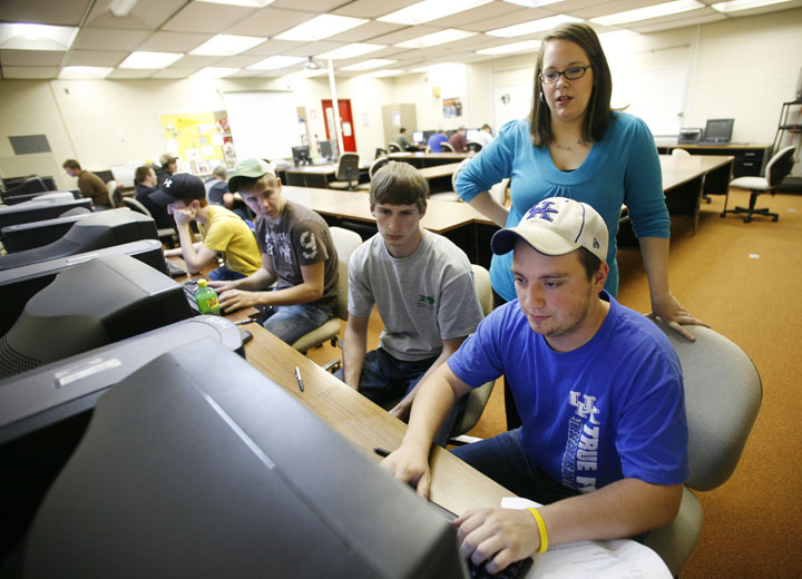 Krystal Johnson helps Graves County High School junior and machine tool student Khourey Toon work on his resume at the Mayfield/Graves Area Technology Center. Photo by Amy Wallot, Nov. 15, 2011