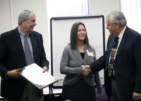 Kathleen Reutman Bryant received the third annual Dr. Johnnie Grissom Award (Strive for Achievement Through Instructional Equity) from Kentucky Board of Education chairman David Karem and Education Commissioner Terry Holliday during Wednesday's KBE meeting. Bryant is executive director of Student/Community Services for the Boone County school district. Photo by Amy Wallot, Dec. 7, 2011