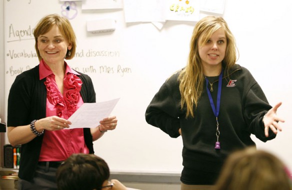 Coordinator for Gifted Education Susan Ryan and language arts teacher Karrie Bal present a book project to Bal's 7th-grade Target class at T.K. Stone Middle School (Elizabethtown Ind.). Bal, a first-year teacher, teaches three gifted and talented classes. Photo by Amy Wallot, Jan. 17, 2012