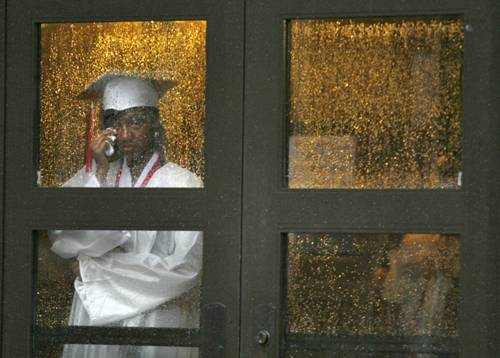Tashi Gay wipes a tear away after the graduation ceremony at Holmes High School (Covington Independent) was cancelled due to heavy storms knocking out the power. Gay said she had family in from out of town for the event and wasn't sure if they would be able to make it to the rescheduled ceremony. She plans on studying nursing at Thomas More College. Photo by Amy Wallot, June 10, 2011