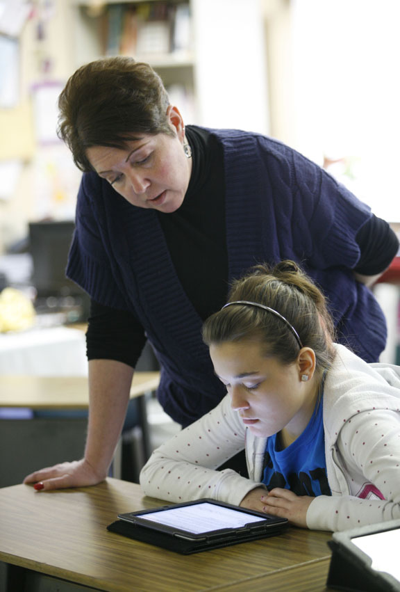 National Board Certified Teacher Joyce Bruner helps 8th-grade student Sarah Cilinceon work on her digital driver's license at The Providence School (Jessamine County). Photo by Amy Wallot, Jan. 26, 2012