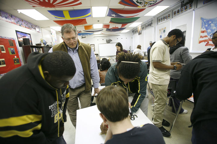 Joe Gutmann watches over students creating hallway posters to remind fellow students to watch their language during his law and government class at Central High School (Jefferson County). Photo by Amy Wallot, Jan. 31, 2012