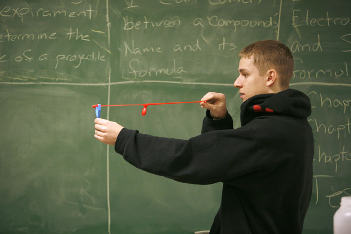 Senior Andrew Marsee launches a sling shot device during a lab on projectile motion in Michael Barker's Honors Physics class at Newport High School (Newport Ind.). Photo by Amy Wallot, Feb. 9, 2012