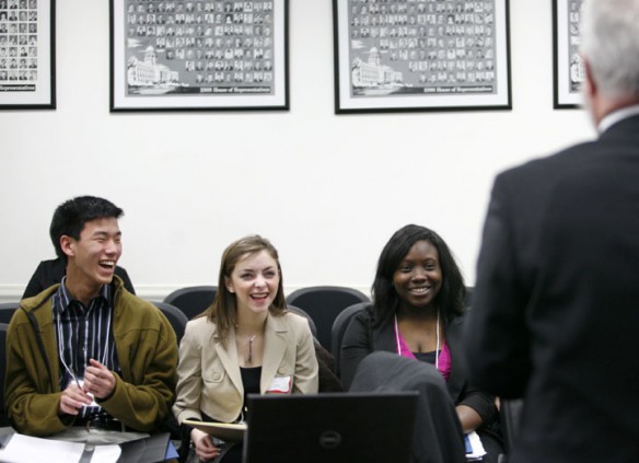 Henderson County High School junior Jake Walker, Russell High School sophomore Morgan Casto and Murray High School sophomore Tiffany Parham laugh with House Education Chairman and state Rep. Carl Rollins as he jokes with them about education bills during the inaugural meeting of the Next-Generation Student Council in Frankfort. Photo by Amy Wallot, Feb. 28, 2012