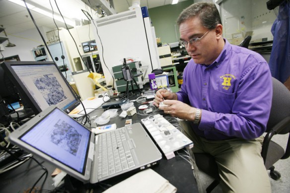 Louisville Male High School (Jefferson County) teacher Jeff Wright experiments with building Knudsen pumps during the High School Teacher Fellowship Program at the University of Louisville.