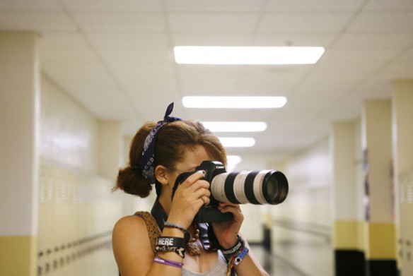 Senior Kamila McDowell works on proper exposure under florescent lights during yearbook camp at Woodford County High School. McDowell is an art student who was asked to bring her creativity to the yearbook staff. Photo by Amy Wallot, July 26, 2012