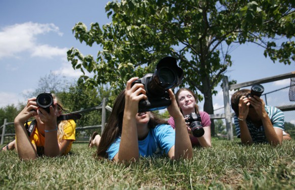 Juniors Leah Brown and Jamie Muth and seniors Keely Wagner and Franklin Watson practice expose in different light situations during yearbook camp at Woodford County High School. Photo by Amy Wallot, July 26, 2012