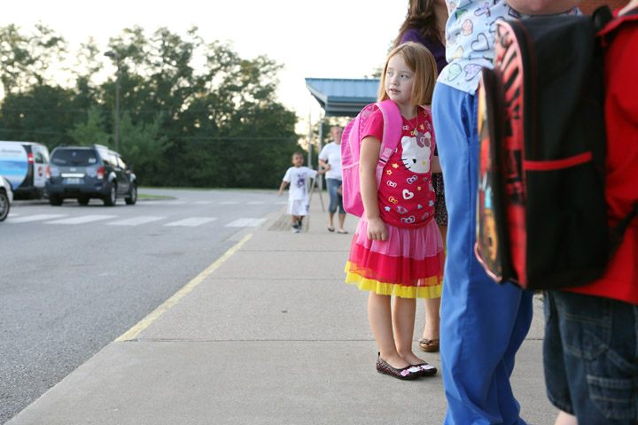 Kindergarten student Kylie Dean waits for the doors to open before the first day of classes at the Early Learning Village (Franklin County). Photo by Amy Wallot, Aug. 8, 2012