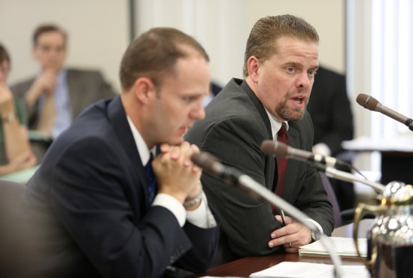 Associate Commissioner Kevin Brown and Division Director David Cook present articles of incorporation for the Fund for Transforming Education in Kentucky during the Kentucky Board of Education meeting in Frankfort, Ky. Photo by Amy Wallot, Aug. 9, 2012