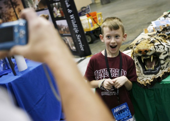 Jaylon Nunn, a 2nd-grade student at A.B. Chandler Elementary School (Henderson County), has his picture takes with a tiger skin. Photo by Amy Wallot, Aug 23, 2012