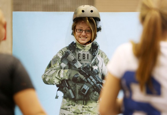Anderson County High School senior Rachael Walker checks out what she would look like as an FBI agent for a photo with friends. Photo by Amy Wallot, Aug 23, 2012