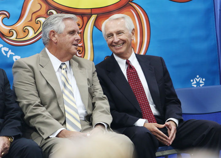 Kentucky Education Commissioner Terry Holliday and Gov. Steve Beshear talk during a press conference at Locust Trace AgriScience Farm (Fayette County), where the governor signed an executive order that unites the state's two career and technical education (CTE) systems under the Kentucky Department of Education. Photo by Amy Wallot, Aug. 28, 2012