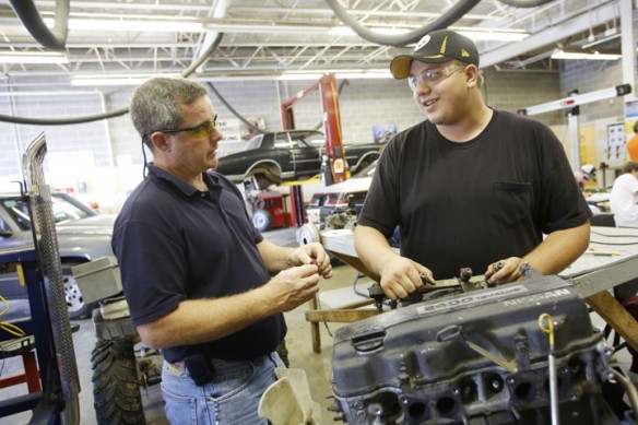 Brian Dugan talks fuel injectors with Bullitt County CRC junior Corey Ivy in the automotive lab at the Bullitt County Area Technology Center. Ivy would like to open an automotive shop one day. Photo by Amy Wallot, Sept. 5, 2012