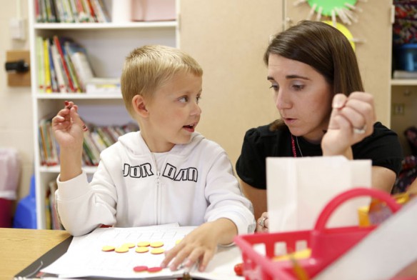 First-grade student Tyler Maggard demonstrates his counting skills for Jamee Markwell during her class. Photo by Amy Wallot, Sept. 10, 2012