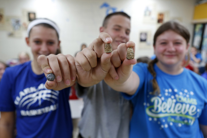 Eighth-grade students Laylee Burchell, Blake Turner and Hannah Harrison display their Civil War bullets during Sharon Graves' 8th-grade American History class at Clark-Moores Middle School (Madison County). Each student in the class was assigned a bullet and wrote a narrative about it. Photo by Amy Wallot, Oct. 15, 2012