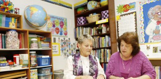 Second-grade teacher Carolyn Noe, left, reviews the peer observation she did in 1st-grade teacher Sharon Clark’s language arts class at Paint Lick Elementary School (Garrard County). Clark said the observation was very helpful and prepared her for her evaluation with her principal.