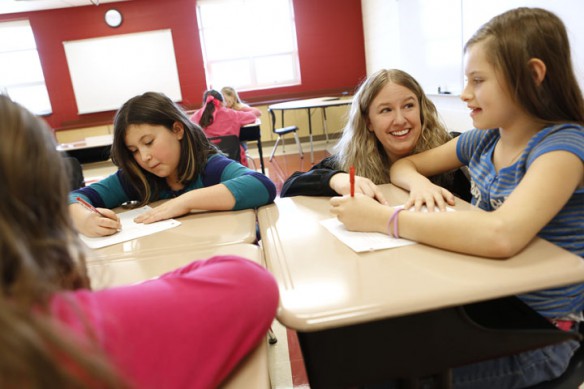 Kristy Floyd helps 4th-grade student Danielle Begley with a writing prompt during her class at West Irving Elementary School (Estill County). Photo by Amy Wallot, Nov. 19, 2012