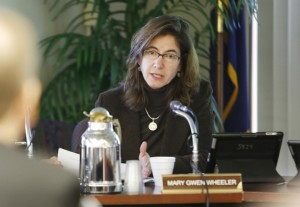 Mary Gwen Wheeler talks with Ken Draut about the recent assessment test scores during the Kentucky Board of Education meeting. Photo by Amy Wallot, Dec. 3, 2012