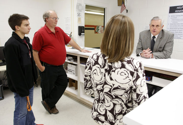 Commissioner Terry Holliday, right, talks with Hart County High School junior Tyler Shirley, computer technician D.L. Talley and curriculum, instruction, and technology specialist Crystal Thompson about the school's one-to-one computer program. With the visit to Hart County, the commissioner reached his goal of visiting all of Kentucky's school districts. Photo by Amy Wallot, Jan. 15, 2013